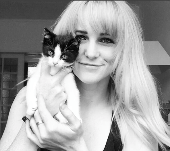 British Ski-cross Pro, Pam Thorburn with a cat. Black and white shot