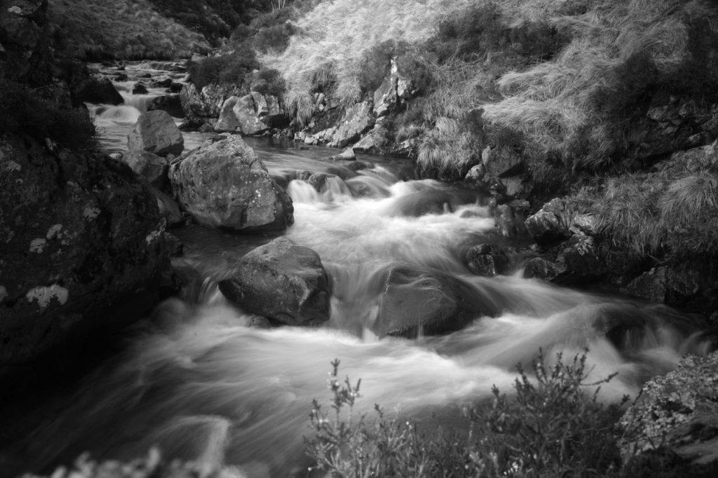 Epic black and white shot of Grey Mare's tail in Kinlochleven. one of the best places to go canyoning in Scotland. 